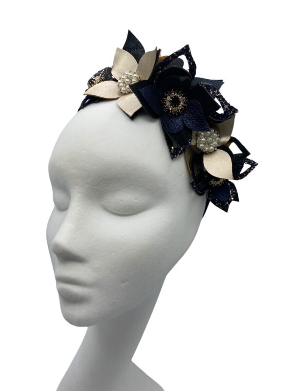 Navy crown with an array of champagne gold leaves and flowers.
